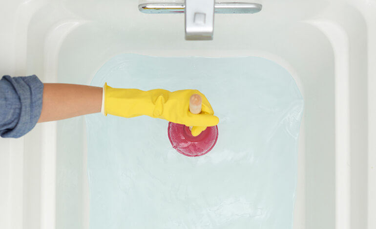 pivot rod being used for a clogged sink drain bathroom