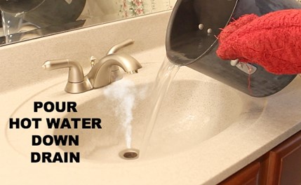 hot water being used as a home remedie for clogged bathroom sink